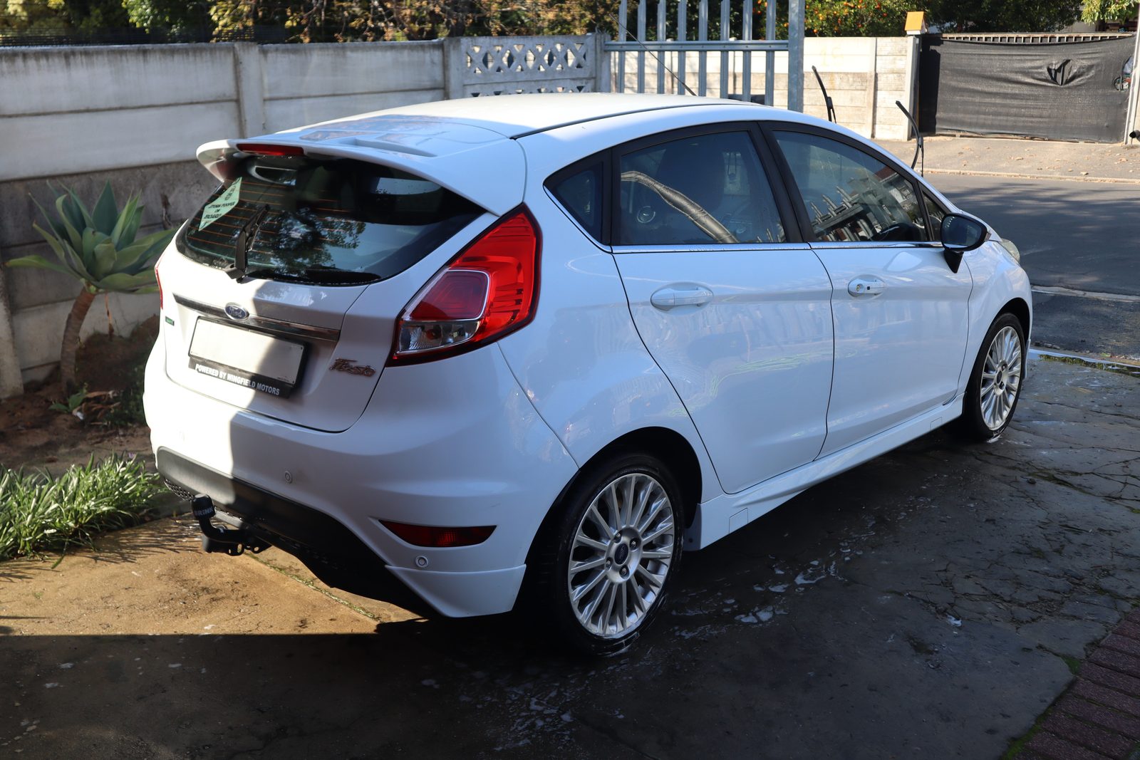 Finished white fleet vehicle after mobile detailing