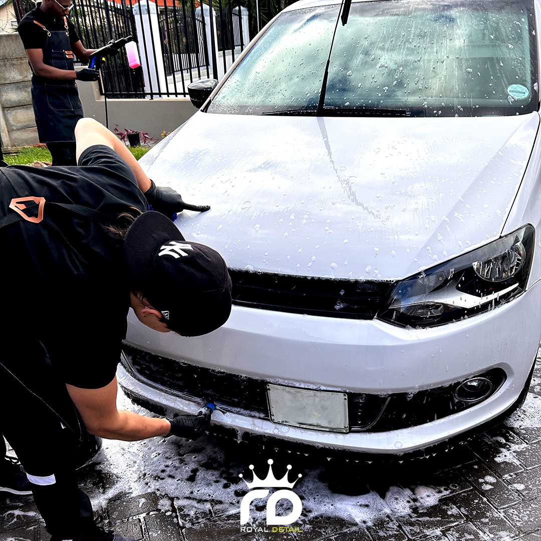 Paint and wash care on a white sedan